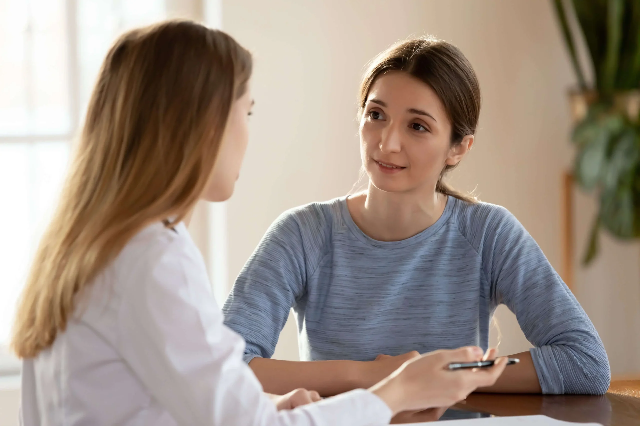 woman talking to a doctor about co-occurring disorders