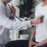 doctor checking a patients lungs