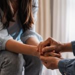 person talking to a loved one about treatment